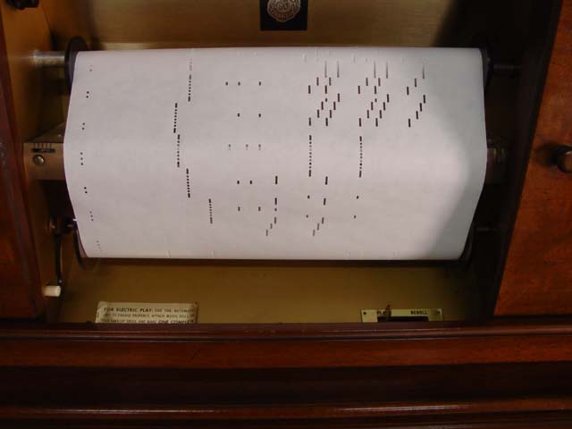 Aeolian player piano with rolls detail