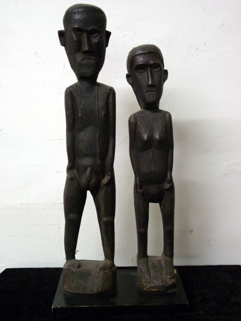 Wood carved tribal statues 25in and 22 in.