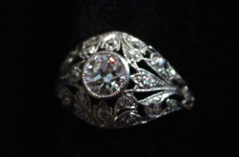 Platinum diamond ring .6ct center w 22 small diam