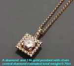 Diamond and 14k gold pendant with central diamond weight 0.70ct