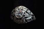 Platinum diamond ring .6ct center w 22 small diam